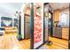 View through doorways to living room and kitchen with modern appliances at 1365 N Corona St # 11, Denver, CO 80218