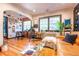 Inviting living room with hardwood floors, stylish furnishings, and a cozy reading nook by the window at 1365 N Corona St # 11, Denver, CO 80218
