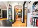 Open-concept living area flowing into a kitchen, with hardwood floors, an archway and stylish decor at 1365 N Corona St # 11, Denver, CO 80218