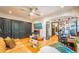 Spacious living room featuring dark-stained wood doors, Zebra wallpaper, and an open layout with hardwood floors at 1365 N Corona St # 11, Denver, CO 80218