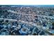 Aerial view of neighborhood with houses and snow at 8716 Starwood Ln, Parker, CO 80134