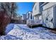 Snowy backyard with a deck and a view of the house at 8716 Starwood Ln, Parker, CO 80134