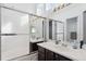 Bathroom with a shower/tub combo and double vanity at 8716 Starwood Ln, Parker, CO 80134