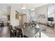 Bright dining area with gray table and chairs; kitchen view at 8716 Starwood Ln, Parker, CO 80134