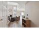 Bright entryway with wood floors, leading to living room at 8716 Starwood Ln, Parker, CO 80134