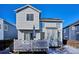 Back exterior view showing house and deck in winter at 8716 Starwood Ln, Parker, CO 80134