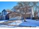 Two-story house with attached garage and front porch at 8716 Starwood Ln, Parker, CO 80134