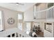 Open living room with loft and fireplace at 8716 Starwood Ln, Parker, CO 80134