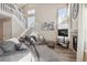 Open living area with gray sectional sofa and fireplace at 8716 Starwood Ln, Parker, CO 80134