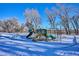 playground with slides and play structures in the snow at 8716 Starwood Ln, Parker, CO 80134