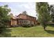 Expansive backyard featuring mature trees, a wood shed, and a lush lawn at 365 Seminole Dr, Boulder, CO 80303