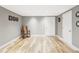 Neutral basement with hardwood floors, accent wall art and ample natural light at 365 Seminole Dr, Boulder, CO 80303