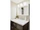 Bathroom vanity with a white marble countertop, modern faucet, and large mirror at 365 Seminole Dr, Boulder, CO 80303