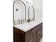 Bathroom features marble countertop with dual sinks and large mirrors at 365 Seminole Dr, Boulder, CO 80303