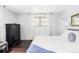 Bedroom with hardwood floors, black dresser, and bright natural light at 365 Seminole Dr, Boulder, CO 80303