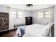 Bedroom with hardwood floors, black dresser, decor, ceiling fan and plenty of natural light at 365 Seminole Dr, Boulder, CO 80303