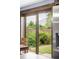 Mountain views are showcased via the large glass doors in this dining room that lead to the backyard at 365 Seminole Dr, Boulder, CO 80303