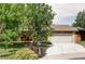 Charming two-story home with a large front yard, a two-car garage and a welcoming front porch at 365 Seminole Dr, Boulder, CO 80303