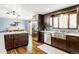 Charming kitchen with stainless steel appliances, and dark-stained wood cabinets at 365 Seminole Dr, Boulder, CO 80303
