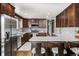 Spacious kitchen featuring stainless steel appliances, wood cabinets, and quartz countertops at 365 Seminole Dr, Boulder, CO 80303