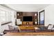 Comfortable living room featuring a wood accent wall, hardwood floors, and modern decor at 365 Seminole Dr, Boulder, CO 80303