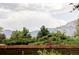 Breathtaking mountain views provide a serene backdrop to this charming property's exterior at 365 Seminole Dr, Boulder, CO 80303