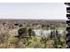 Picturesque aerial view captures the home's surrounding lush landscape and lake at 460 S Marion Pkwy # 1701, Denver, CO 80209