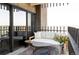 Relaxing balcony features comfortable seating, stylish decor, and city views at 460 S Marion Pkwy # 1701, Denver, CO 80209