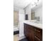Stylish bathroom with a modern vanity, sleek fixtures, and tiled shower at 460 S Marion Pkwy # 1701, Denver, CO 80209