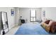 Comfortable bedroom featuring a plush bed, study area, and natural light at 460 S Marion Pkwy # 1701, Denver, CO 80209
