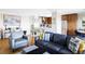 Stylish living room with open layout, kitchen bar, and comfortable seating perfect for relaxation at 460 S Marion Pkwy # 1701, Denver, CO 80209