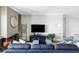 Modern living room with fireplace, television, and comfortable furniture offers an inviting ambiance at 460 S Marion Pkwy # 1701, Denver, CO 80209