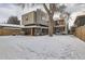 Backyard view of a modern home in the winter at 3915 W Byron Pl, Denver, CO 80212