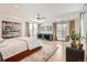 Spacious bedroom with hardwood floors and access to balcony at 3915 W Byron Pl, Denver, CO 80212