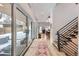 Light-filled hallway with hardwood floors and access to backyard at 3915 W Byron Pl, Denver, CO 80212