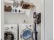 Convenient laundry room with washer, dryer, and storage at 3915 W Byron Pl, Denver, CO 80212