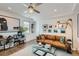 Stylish living room with leather sofa and gallery wall at 3915 W Byron Pl, Denver, CO 80212