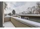 Spacious deck overlooking snowy neighborhood; perfect for winter views at 3915 W Byron Pl, Denver, CO 80212