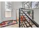 Modern stairwell with sleek metal railing at 3915 W Byron Pl, Denver, CO 80212