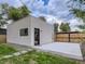Detached studio with concrete patio and gate at 3915 W Byron Pl, Denver, CO 80212