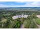 Aerial view of estate, showcasing its sprawling grounds, luxurious design, and scenic mountain backdrop at 606 Cliffgate Ln, Castle Rock, CO 80108