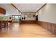 Expansive game room features wood paneling, recessed lighting, and an adjoining wet bar area at 606 Cliffgate Ln, Castle Rock, CO 80108
