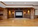 Home theater with custom wood paneling, built-in cabinets, and a large projection screen at 606 Cliffgate Ln, Castle Rock, CO 80108
