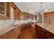 Well-equipped kitchen with custom cabinets, granite countertops, and stainless appliances at 606 Cliffgate Ln, Castle Rock, CO 80108