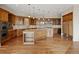 Gourmet kitchen featuring custom cabinets, stainless steel appliances, and large island at 606 Cliffgate Ln, Castle Rock, CO 80108