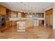Spacious kitchen featuring an island, granite countertops, stainless appliances, and custom cabinets at 606 Cliffgate Ln, Castle Rock, CO 80108
