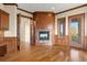Cozy living room with hardwood floors, fireplace and door to the outside at 606 Cliffgate Ln, Castle Rock, CO 80108