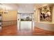 Wide open living area with dark-stained floors and a large view window to bring the outdoors in at 606 Cliffgate Ln, Castle Rock, CO 80108