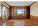 Room with custom built-ins and a scenic view from the large window at 606 Cliffgate Ln, Castle Rock, CO 80108