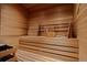 Cozy sauna room with wooden benches and walls at 606 Cliffgate Ln, Castle Rock, CO 80108